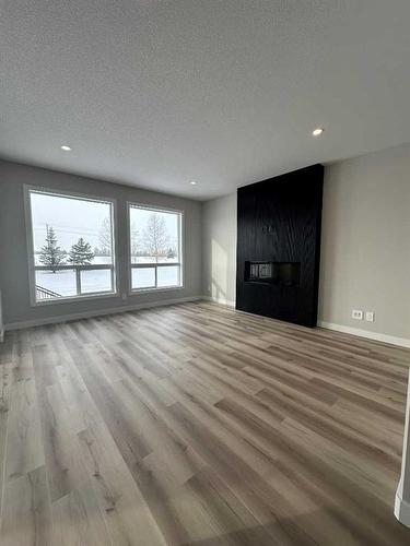 40 Emmett Crescent, Red Deer, AB - Indoor Photo Showing Living Room With Fireplace