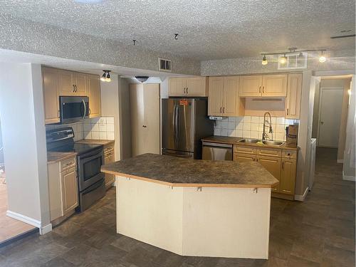 6608 44B Avenue, Camrose, AB - Indoor Photo Showing Kitchen With Double Sink