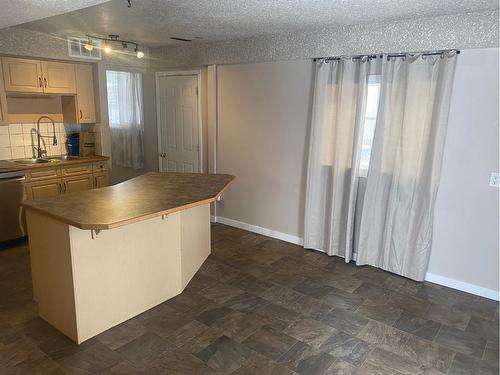 6608 44B Avenue, Camrose, AB - Indoor Photo Showing Kitchen With Double Sink