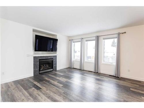 37 Ogilvie Close, Red Deer, AB - Indoor Photo Showing Living Room With Fireplace