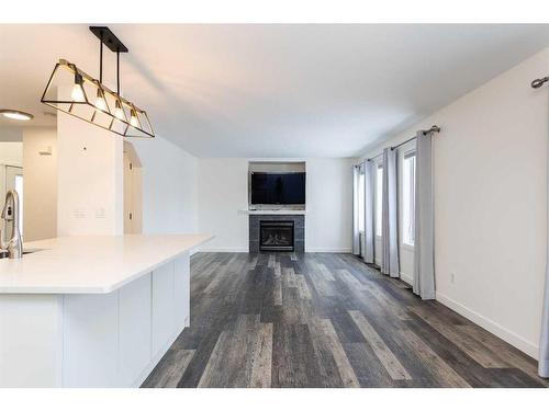 37 Ogilvie Close, Red Deer, AB - Indoor Photo Showing Other Room With Fireplace