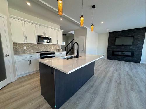 53 Emmett Crescent, Red Deer, AB - Indoor Photo Showing Kitchen With Double Sink With Upgraded Kitchen