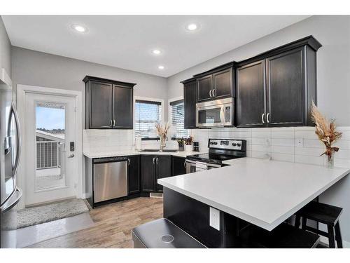 49 Aztec Crescent, Blackfalds, AB - Indoor Photo Showing Kitchen With Double Sink With Upgraded Kitchen