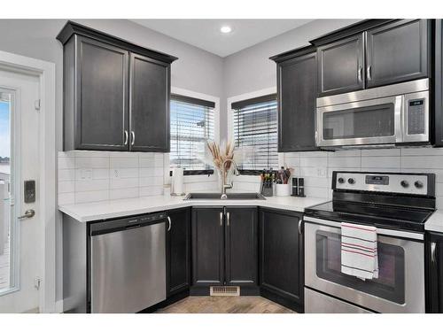 49 Aztec Crescent, Blackfalds, AB - Indoor Photo Showing Kitchen With Double Sink With Upgraded Kitchen