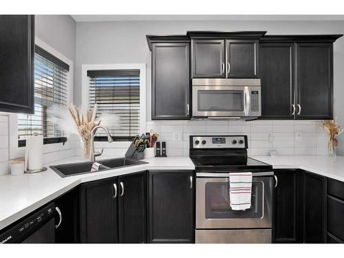 49 Aztec Crescent, Blackfalds, AB - Indoor Photo Showing Kitchen With Double Sink With Upgraded Kitchen