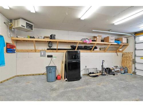 49 Aztec Crescent, Blackfalds, AB - Indoor Photo Showing Garage