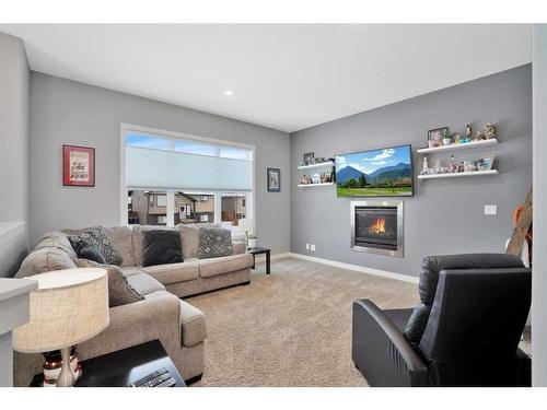 49 Aztec Crescent, Blackfalds, AB - Indoor Photo Showing Living Room With Fireplace