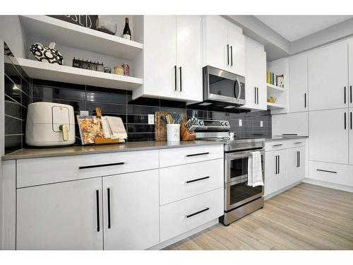 89 Memorial Parkway, Rural Red Deer County, AB - Indoor Photo Showing Kitchen