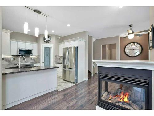 2 Garrison Place, Red Deer, AB - Indoor Photo Showing Other Room With Fireplace