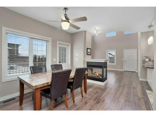 2 Garrison Place, Red Deer, AB - Indoor Photo Showing Dining Room With Fireplace