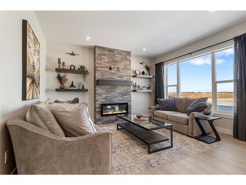 6 Aura Drive, Blackfalds, AB - Indoor Photo Showing Living Room With Fireplace