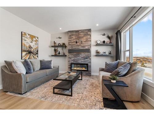 6 Aura Drive, Blackfalds, AB - Indoor Photo Showing Living Room With Fireplace