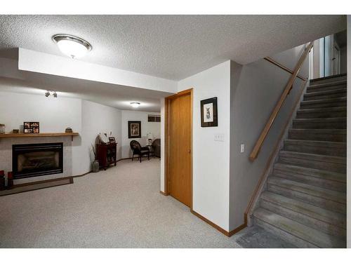 5304 58 Street Close, Camrose, AB - Indoor With Fireplace