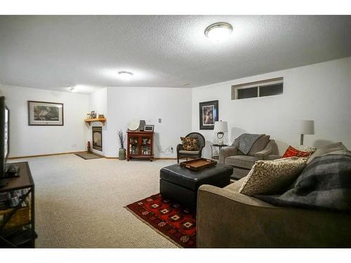 5304 58 Street Close, Camrose, AB - Indoor Photo Showing Living Room With Fireplace