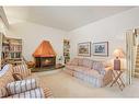 27 Selkirk Boulevard, Red Deer, AB  - Indoor Photo Showing Living Room With Fireplace 