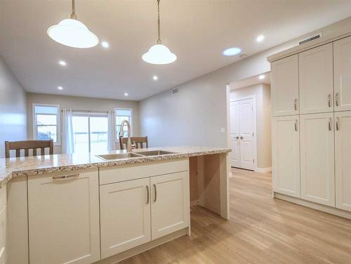 4509 B 56A Street Close, Stettler, AB - Indoor Photo Showing Kitchen With Double Sink