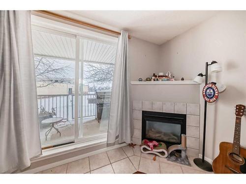 114-60 Lawford Avenue, Red Deer, AB - Indoor With Fireplace