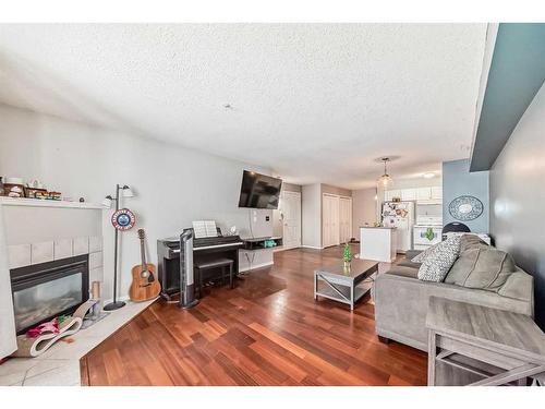 114-60 Lawford Avenue, Red Deer, AB - Indoor Photo Showing Living Room With Fireplace