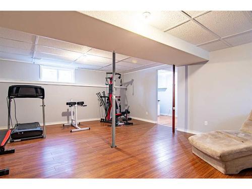 5144 52 Street, Caroline, AB - Indoor Photo Showing Gym Room