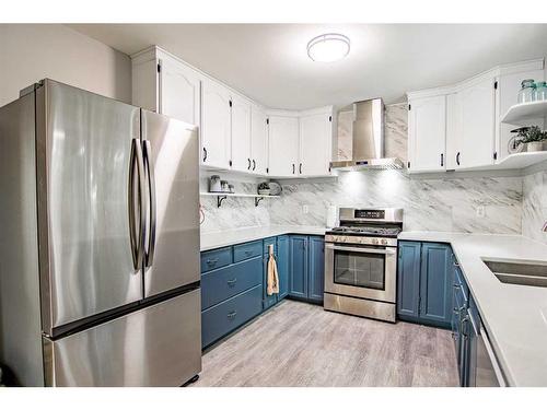 5144 52 Street, Caroline, AB - Indoor Photo Showing Kitchen With Double Sink With Upgraded Kitchen