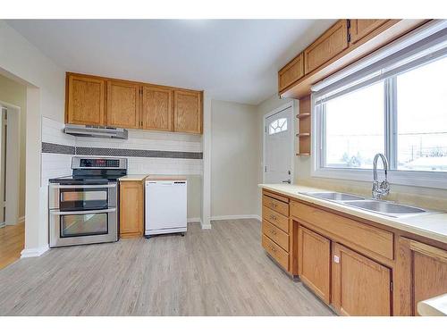 4013 47 Street, Red Deer, AB - Indoor Photo Showing Kitchen With Double Sink