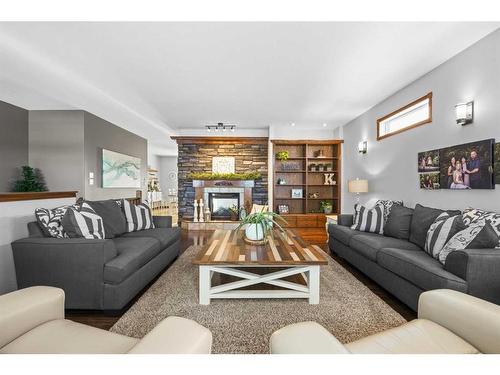 21-40419 Range Road 10, Rural Lacombe County, AB - Indoor Photo Showing Living Room With Fireplace