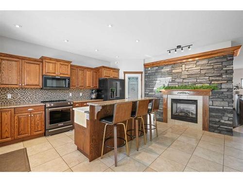 21-40419 Range Road 10, Rural Lacombe County, AB - Indoor Photo Showing Kitchen With Fireplace