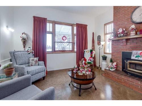 5450 49 Avenue, Lacombe, AB - Indoor Photo Showing Living Room With Fireplace