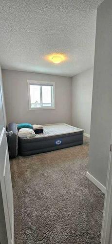 386 Hillcrest Road Sw, Airdrie, AB - Indoor Photo Showing Bedroom