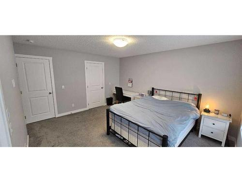 386 Hillcrest Road Sw, Airdrie, AB - Indoor Photo Showing Bedroom