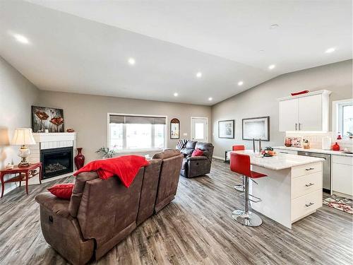 5011 B 49 Street, Stettler, AB - Indoor Photo Showing Living Room With Fireplace