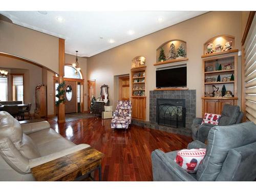 5104 55 Street Close, Eckville, AB - Indoor Photo Showing Living Room With Fireplace