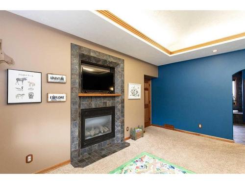 5104 55 Street Close, Eckville, AB - Indoor With Fireplace