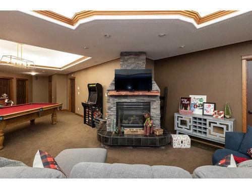 5104 55 Street Close, Eckville, AB - Indoor Photo Showing Other Room With Fireplace