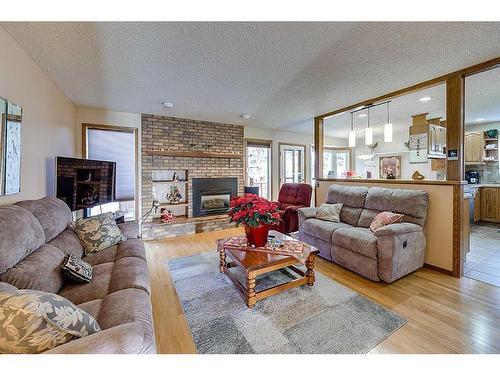 25 Rose Crescent, Red Deer, AB - Indoor Photo Showing Living Room With Fireplace