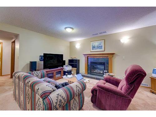 25 Rose Crescent, Red Deer, AB - Indoor Photo Showing Living Room With Fireplace