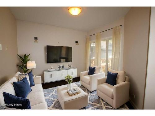 13 Ralston Place, Sylvan Lake, AB - Indoor Photo Showing Living Room