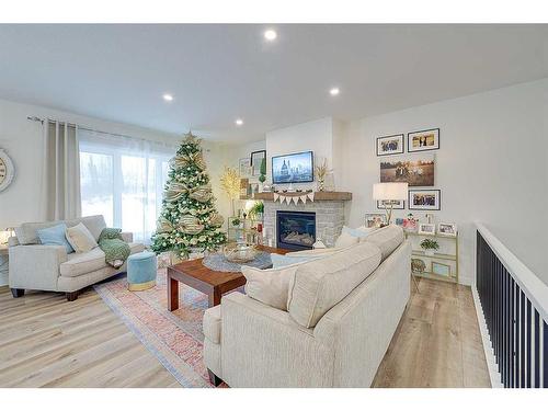 32 Eagle Drive, Rural Lacombe County, AB - Indoor Photo Showing Living Room With Fireplace