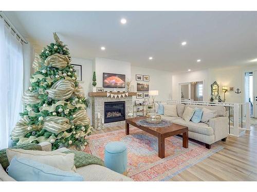 32 Eagle Drive, Rural Lacombe County, AB - Indoor Photo Showing Living Room With Fireplace