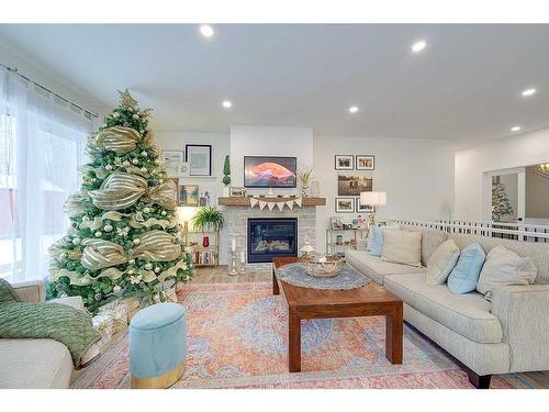 32 Eagle Drive, Rural Lacombe County, AB - Indoor Photo Showing Living Room With Fireplace