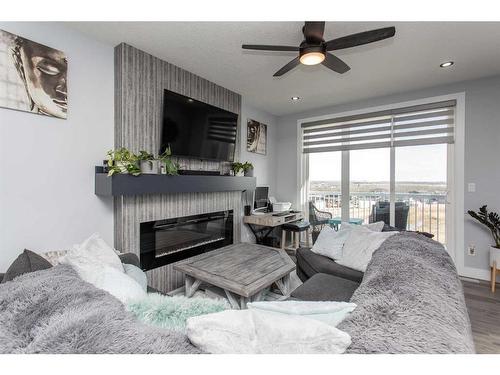 4175 Ryders Ridge Boulevard, Sylvan Lake, AB - Indoor Photo Showing Living Room With Fireplace