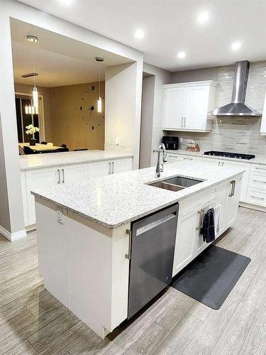 238 Kingfisher Crescent Se, Airdrie, AB - Indoor Photo Showing Kitchen With Double Sink