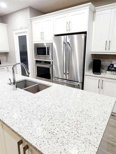 238 Kingfisher Crescent Se, Airdrie, AB - Indoor Photo Showing Kitchen With Stainless Steel Kitchen With Double Sink