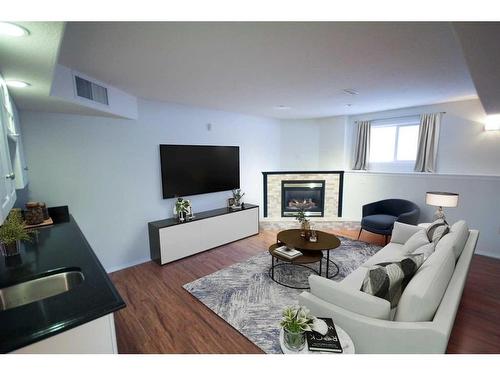 22 Willow Springs Crescent, Sylvan Lake, AB - Indoor Photo Showing Living Room With Fireplace