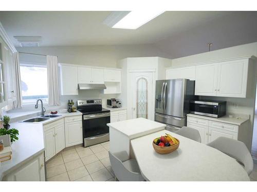 22 Willow Springs Crescent, Sylvan Lake, AB - Indoor Photo Showing Kitchen With Double Sink