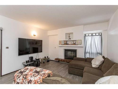 5214 Silverpark Close, Olds, AB - Indoor Photo Showing Living Room With Fireplace