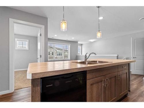 200-44 Reid Court, Sylvan Lake, AB - Indoor Photo Showing Kitchen With Double Sink