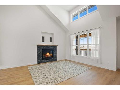 45 Bruhn Bend, Rural Ponoka County, AB - Indoor Photo Showing Living Room With Fireplace