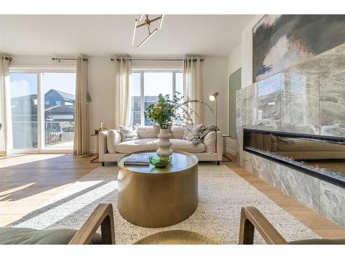 927 Langholm Drive Se, Airdrie, AB - Indoor Photo Showing Living Room With Fireplace