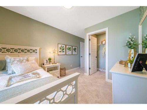 927 Langholm Drive Se, Airdrie, AB - Indoor Photo Showing Bedroom